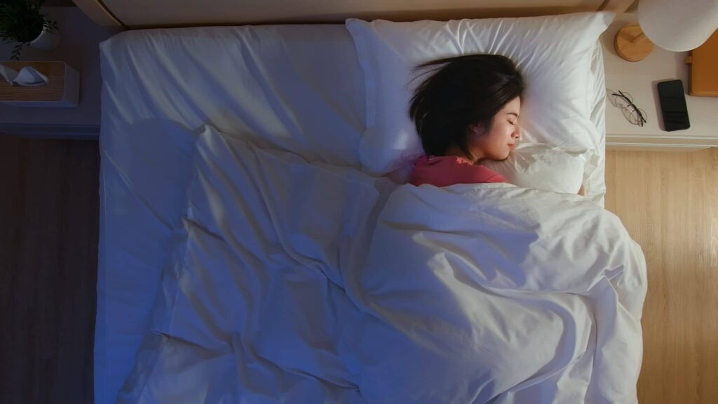 Person sleeping in bed